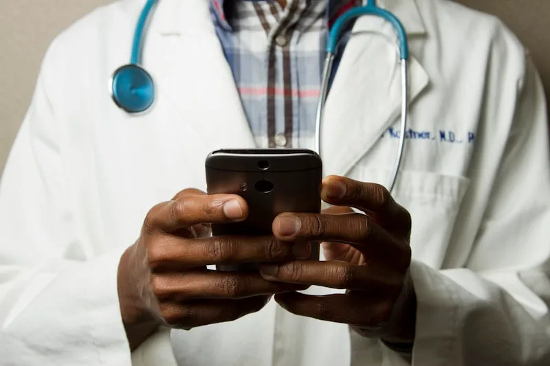 Healthcare practitioner checking an online appointment calendar on a tablet — Doctolib alternative 2026
